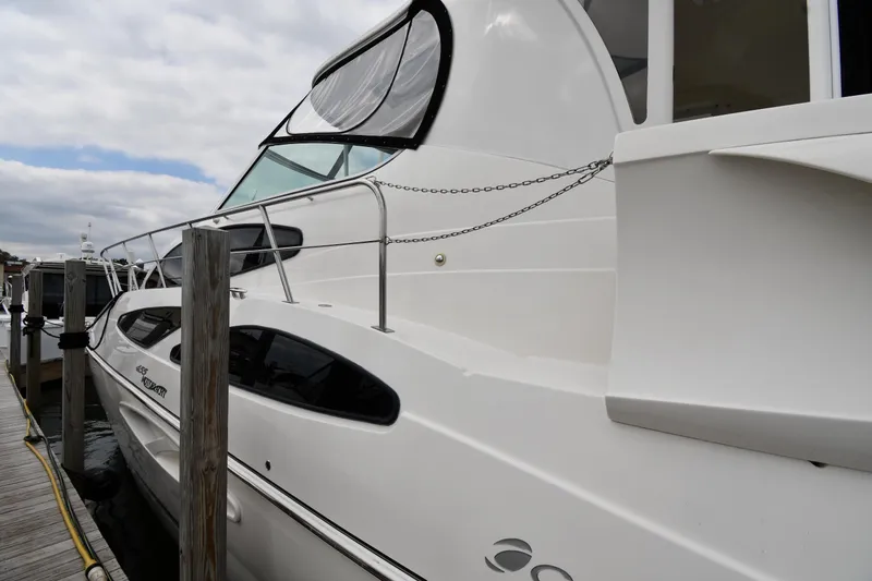 Slide: The Image of 2007 Cruisers Yachts 455 Express Motoryacht docked, showcasing sleek design and modern features. - 2