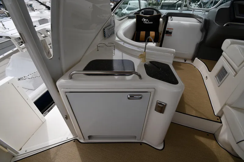 Slide: The Image of 2007 Cruisers Yachts 455 Express Motoryacht interior with kitchenette and seating area. - 22