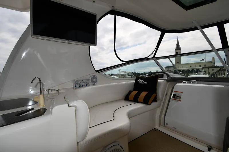 Slide: The Image of 2007 Cruisers Yachts 455 Express Motoryacht interior with seating, sink, and TV. - 25