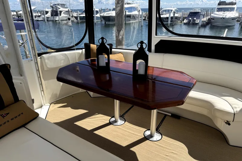 Slide: The Image of Luxurious interior of 2007 Cruisers Yachts 455 Express Motoryacht with elegant seating and table. - 27