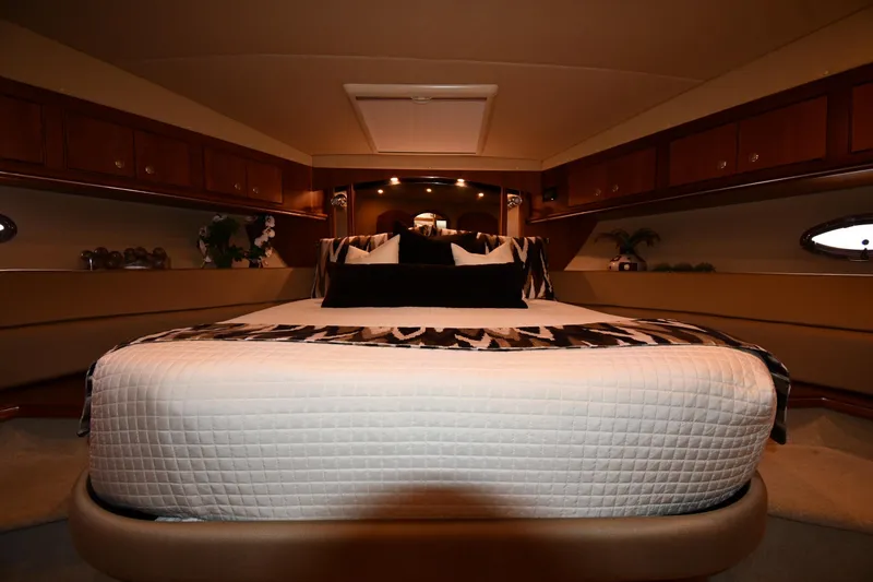 Slide: The Image of Luxurious bedroom interior of 2007 Cruisers Yachts 455 Express Motoryacht with elegant bedding. - 32