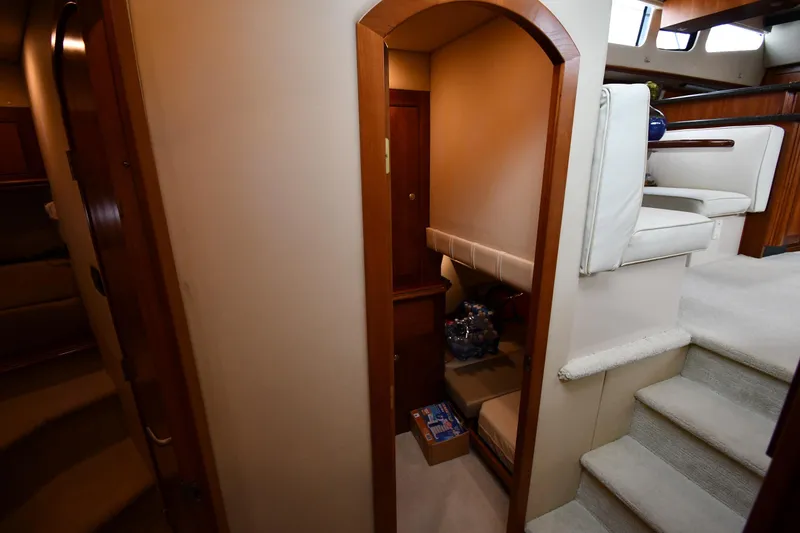 Slide: The Image of Interior view of 2007 Cruisers Yachts 455 Express Motoryacht, featuring stairs and seating area. - 41