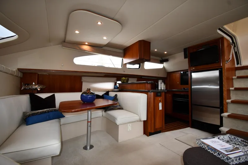 Slide: The Image of Luxurious interior of 2007 Cruisers Yachts 455 Express Motoryacht with modern kitchen and seating area. - 47
