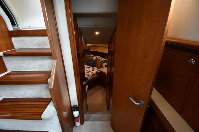 Slide: The Image of 2007 Cruisers Yachts 455 Express Motoryacht interior with stairs and cozy cabin view. - 56