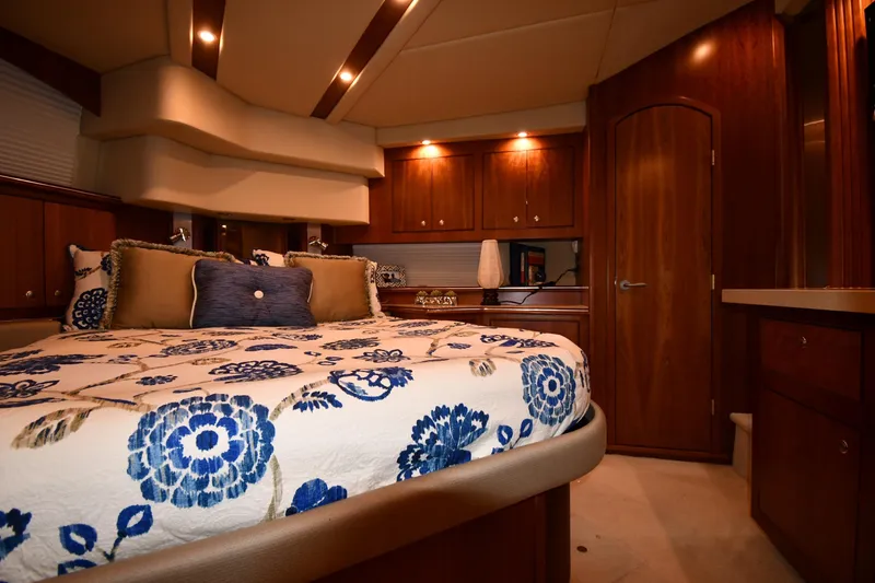 Slide: The Image of Luxurious bedroom interior of 2007 Cruisers Yachts 455 Express Motoryacht with elegant wood finishes. - 58