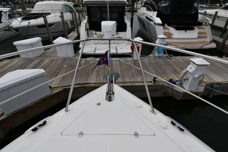 Slide: The Image of 2007 Cruisers Yachts 455 Express Motoryacht docked at marina, viewed from bow. - 6