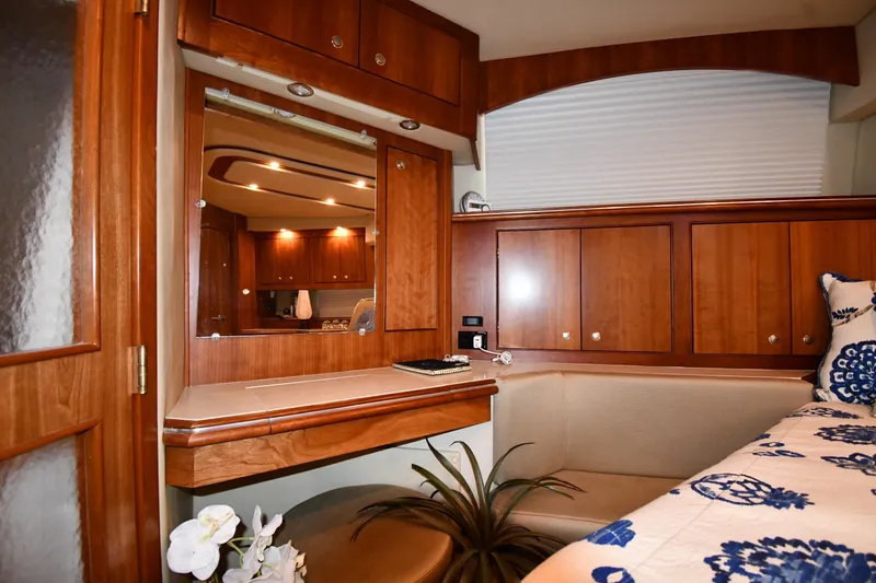 Slide: The Image of Luxurious 2007 Cruisers Yachts 455 Express Motoryacht interior with elegant wood cabinetry. - 61