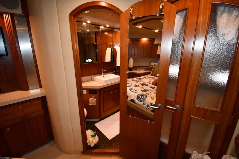 Slide: The Image of Luxurious 2007 Cruisers Yachts 455 Express Motoryacht interior with elegant wood finishes. - 62