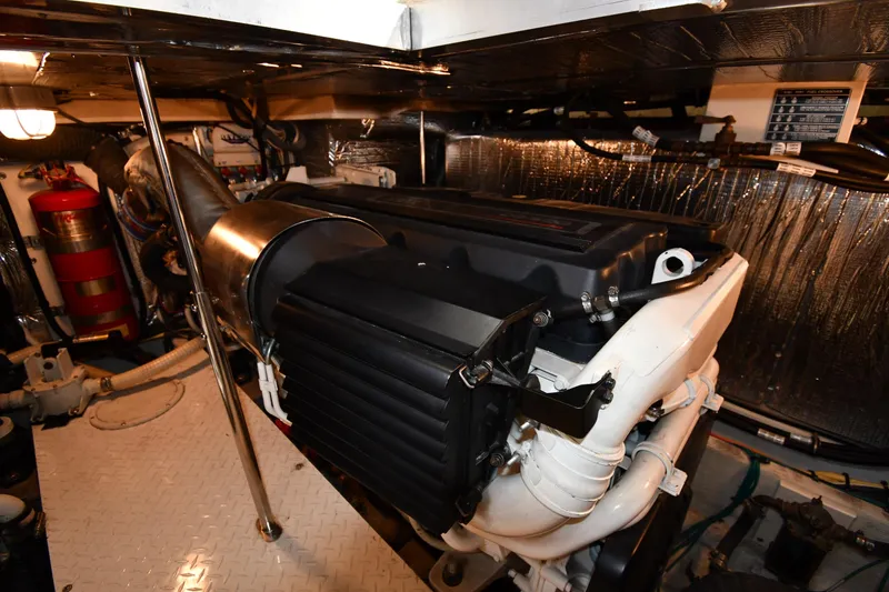 Slide: The Image of Engine room of 2007 Cruisers Yachts 455 Express Motoryacht, featuring mechanical components. - 66