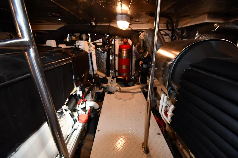 Slide: The Image of Engine room of 2007 Cruisers Yachts 455 Express Motoryacht, featuring mechanical components. - 68