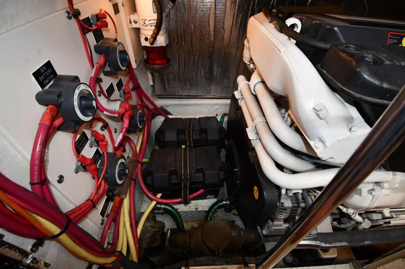 Slide: The Image of Engine room of 2007 Cruisers Yachts 455 Express Motoryacht with wiring and battery switches. - 69