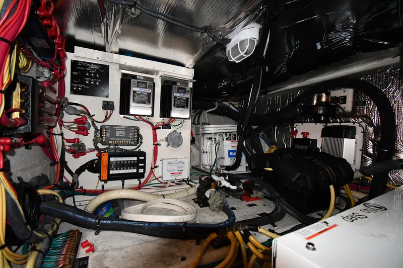 Slide: The Image of Engine room of 2007 Cruisers Yachts 455 Express Motoryacht with wiring and equipment. - 73