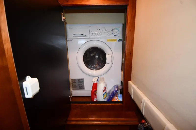 Slide: The Image of Laundry area with washer in 2007 Cruisers Yachts 455 Express Motoryacht. - 74