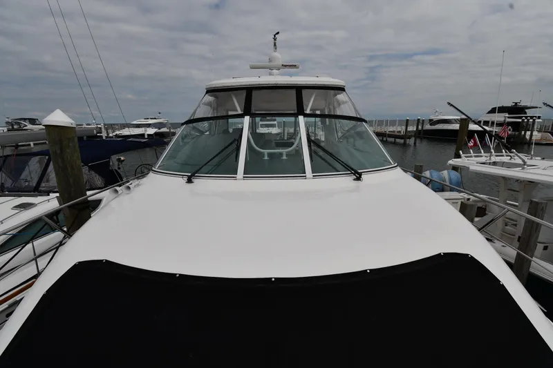 Slide: The Image of 2007 Cruisers Yachts 455 Express Motoryacht docked at marina, front view. - 9