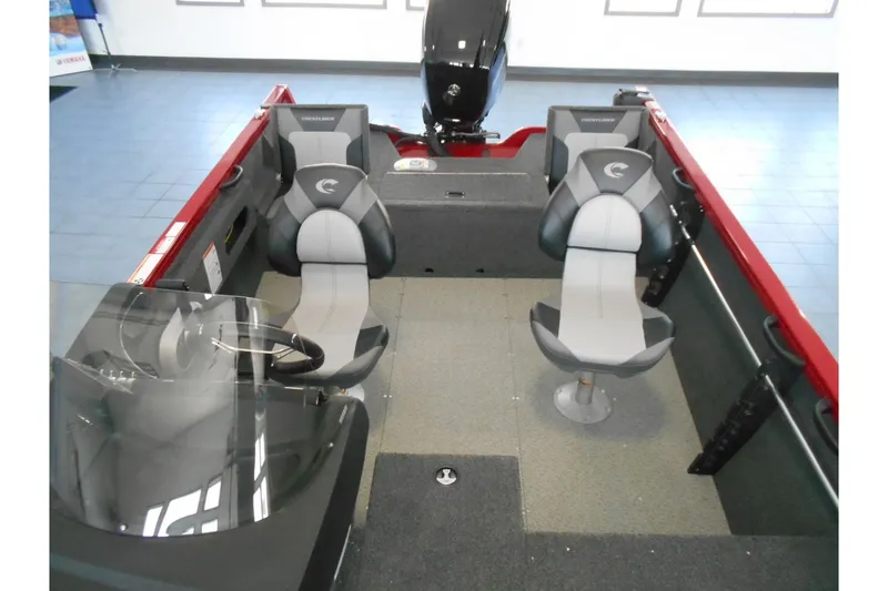 Slide: The Image of 2025 Crestliner 1650 Fish Hawk SC JS interior with seating and motor, showcasing modern design. - 11