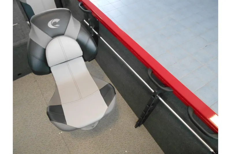 Slide: The Image of 2025 Crestliner 1650 Fish Hawk SC JS boat seat with red trim and gray upholstery. - 12