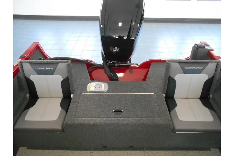 Slide: The Image of 2025 Crestliner 1650 Fish Hawk SC JS boat interior with dual seats and motor. - 13