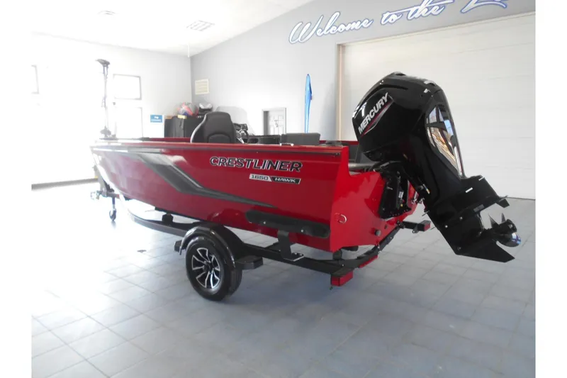 Slide: The Image of 2025 Crestliner 1650 Fish Hawk SC JS boat with Mercury engine in showroom. - 4