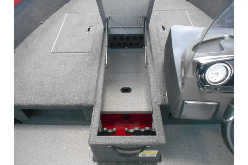 Slide: The Image of 2025 Crestliner 1650 Fish Hawk SC JS boat interior with storage compartments and dashboard. - 7