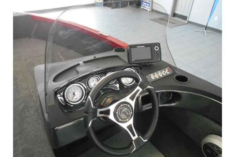 Slide: The Image of 2025 Crestliner 1650 Fish Hawk SC JS dashboard with steering wheel and gauges. - 8