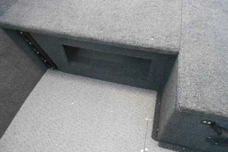 Slide: The Image of Interior of 2025 Crestliner 1650 Fish Hawk SC JS boat, featuring carpeted storage area. - 9