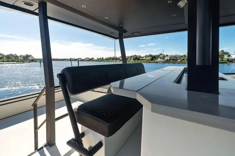 Slide: The Image of Luxurious seating area on 2019 DutchCraft 56 Open yacht with scenic water view. - 11