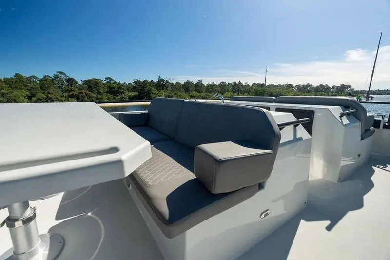Slide: The Image of Luxurious seating area on 2019 DutchCraft 56 Open yacht, with scenic water view. - 21