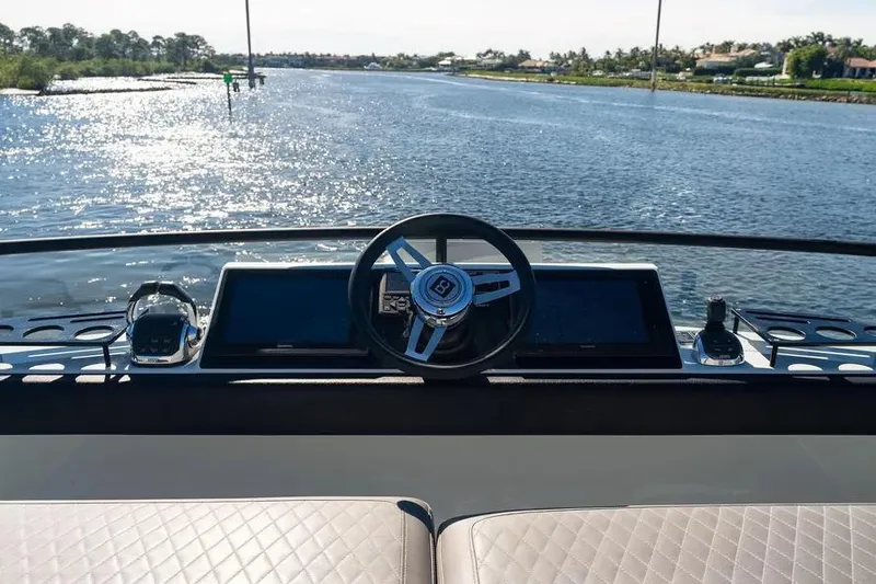 Slide: The Image of Helm of 2019 DutchCraft 56 Open yacht with scenic waterway view. - 23