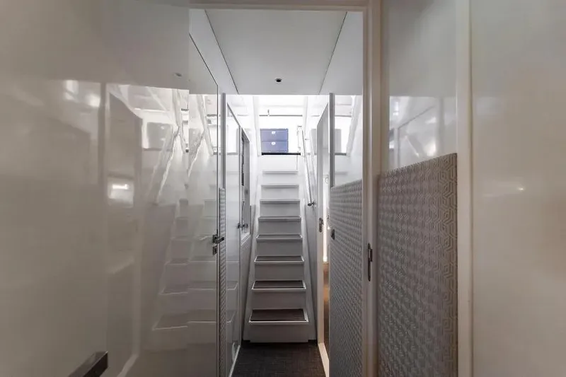 Slide: The Image of Interior view of 2019 DutchCraft 56 Open yacht, featuring sleek white stairs and modern design. - 25