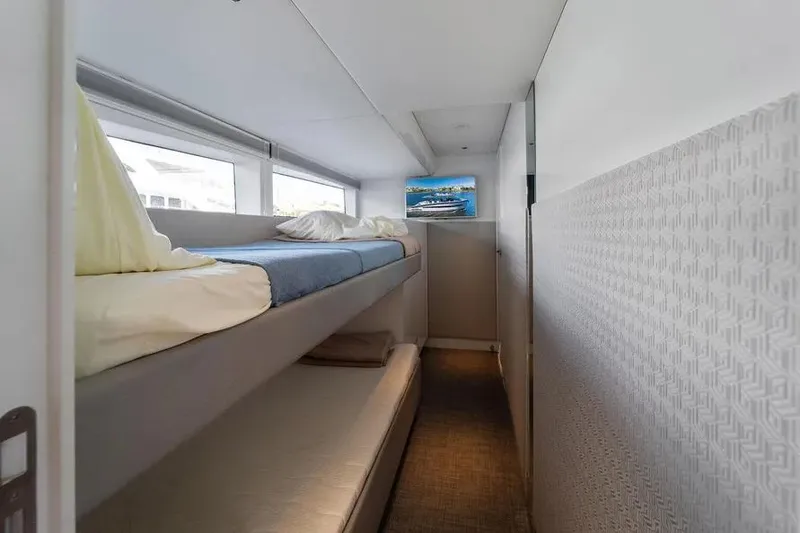 Slide: The Image of Bunk beds in 2019 DutchCraft 56 Open yacht cabin, featuring modern design and natural light. - 27