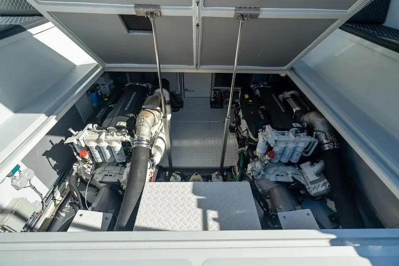 Slide: The Image of Engine compartment of 2019 DutchCraft 56 Open yacht, showcasing dual engines and mechanical components. - 38
