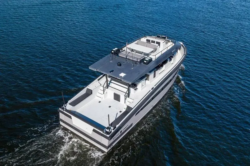 Slide: The Image of 2019 DutchCraft 56 Open yacht cruising on open water. - 4