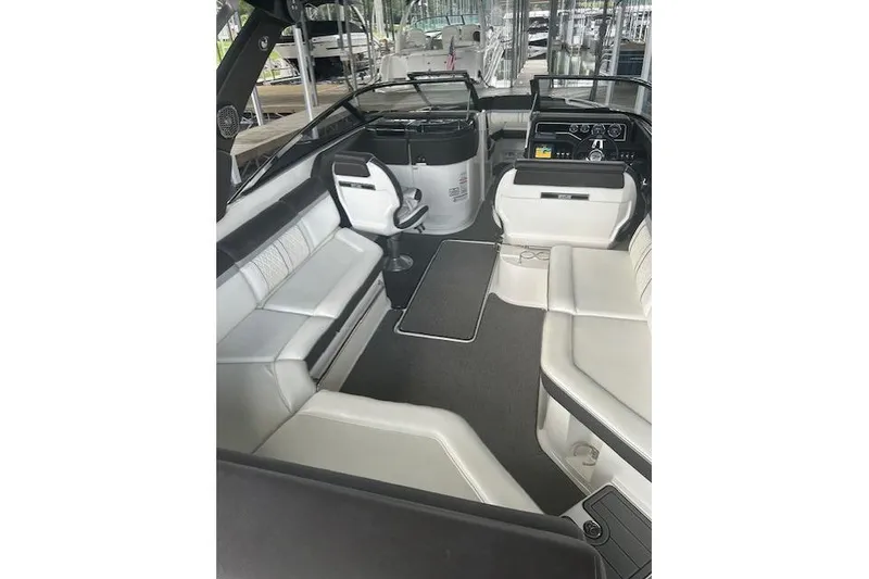 Slide: The Image of 2017 Sea Ray SLX 280 boat interior with white seating and modern dashboard. - 3