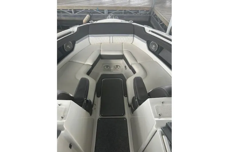 Slide: The Image of 2017 Sea Ray SLX 280 boat interior with cushioned seating and cup holders. - 5