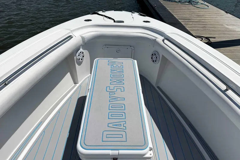 Slide: The Image of 2005 Wellcraft 32 CCF boat interior with "Daddy's Money" text on seat cushion. - 11