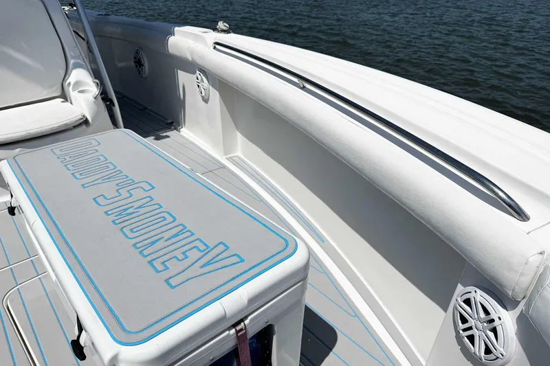 Slide: The Image of 2005 Wellcraft 32 CCF boat interior with "Daddy's Money" text on seat cushion. - 13