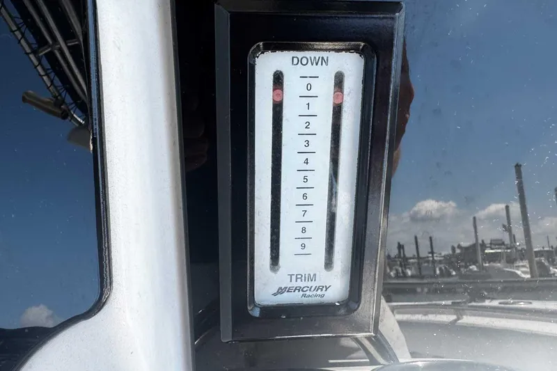 Slide: The Image of Mercury Racing trim gauge on 2005 Wellcraft 32 CCF boat dashboard. - 39