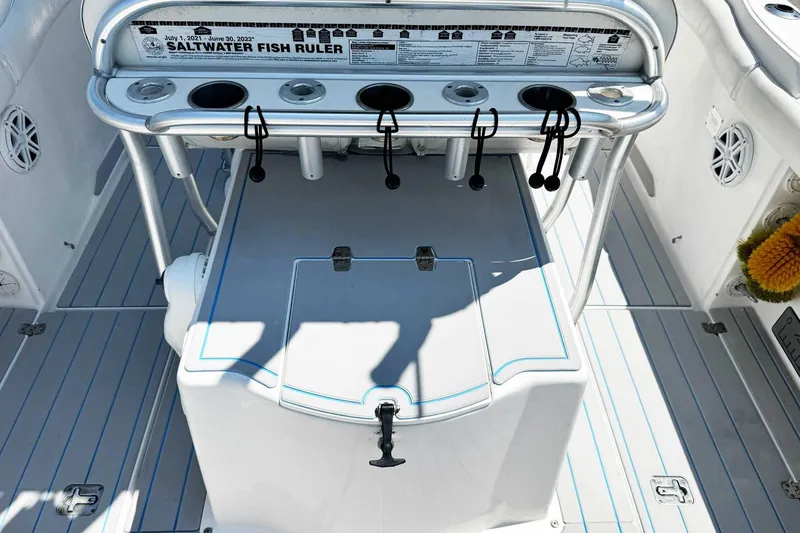 Slide: The Image of 2005 Wellcraft 32 CCF boat deck with fishing rod holders and saltwater fish ruler. - 47
