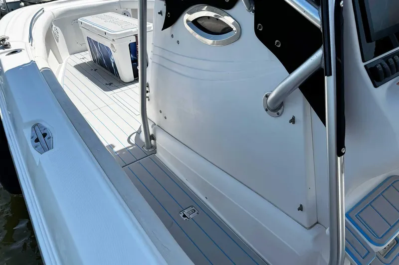 Slide: The Image of 2005 Wellcraft 32 CCF boat interior with seating and storage, featuring sleek design elements. - 53