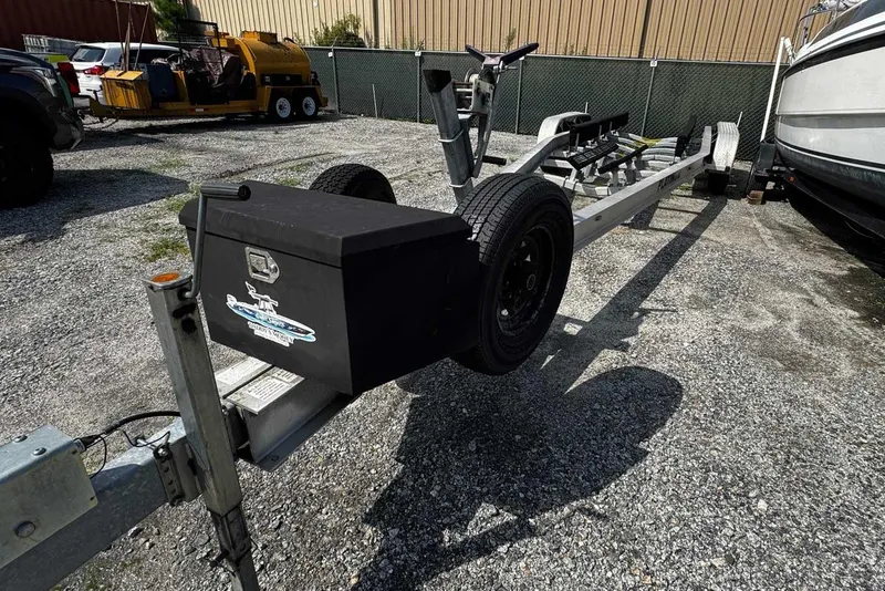 Slide: The Image of Boat trailer for 2005 Wellcraft 32 CCF, parked on gravel lot. - 64