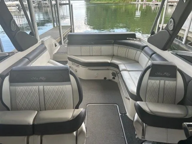 Slide: The Image of 2017 Sea Ray SLX 280 boat interior with luxurious seating and waterfront view. - 5
