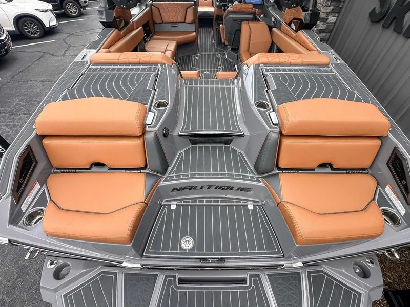 Slide: The Image of Interior of 2023 Nautique Super Air Nautique G23 Paragon with orange seating. - 10