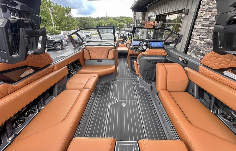 Slide: The Image of Interior of 2023 Nautique Super Air Nautique G23 Paragon with luxurious leather seating. - 13