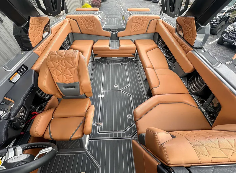 Slide: The Image of Interior of 2023 Nautique Super Air Nautique G23 Paragon with luxurious leather seating. - 16