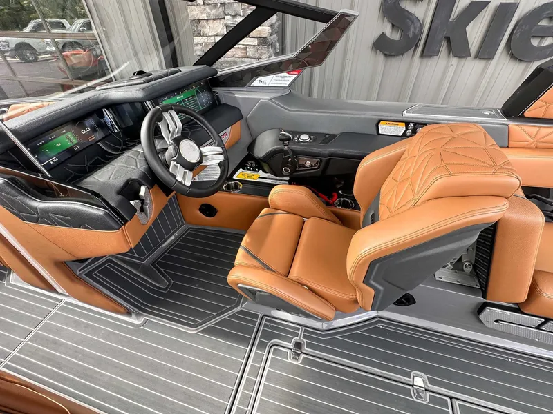 Slide: The Image of Interior of 2023 Nautique Super Air Nautique G23 Paragon with luxurious leather seating. - 18
