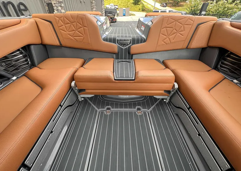 Slide: The Image of Interior of 2023 Nautique Super Air Nautique G23 Paragon with brown leather seating. - 21