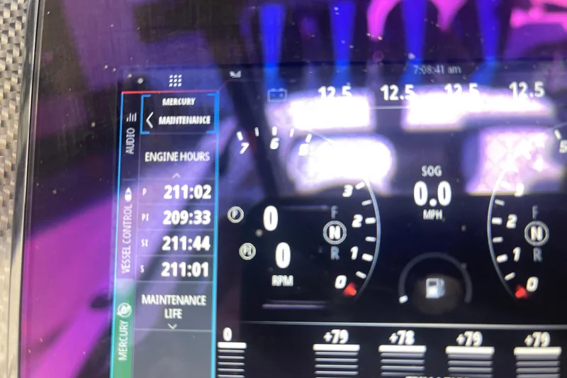 Slide: The Image of Dashboard of 2023 Nor-Tech 390 Sport showing engine hours and maintenance data. - 9