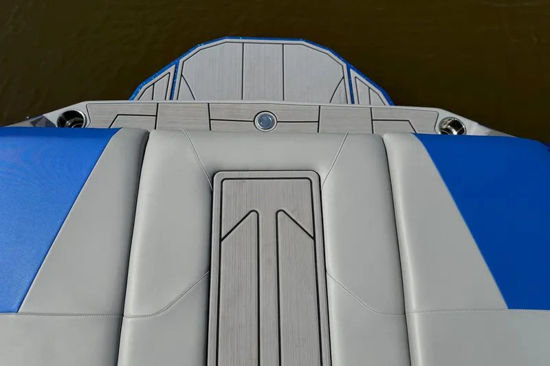 Slide: The Image of 2023 Moomba Max boat deck with blue and gray upholstery, viewed from above. - 8