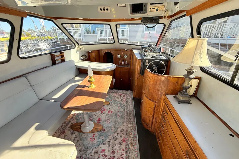 Slide: The Image of Interior of 1989 Mediterranean 38 Express yacht with cozy seating and elegant decor. - 10