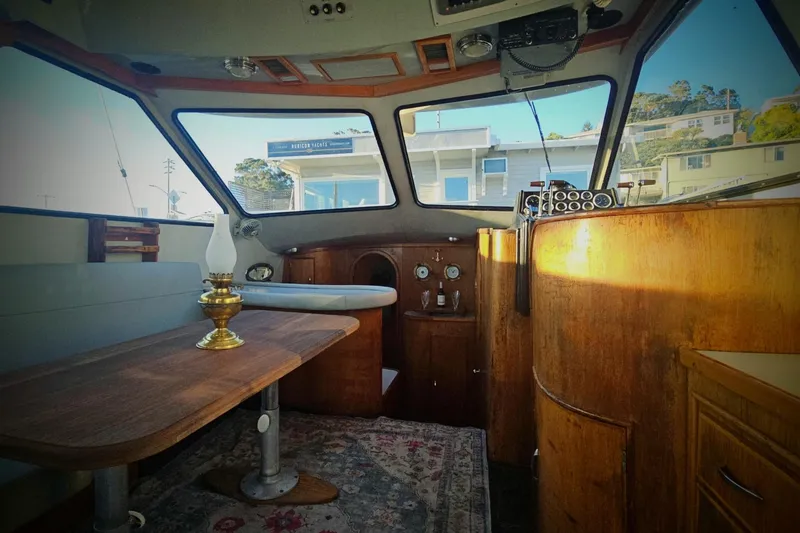 Slide: The Image of 1989 Mediterranean 38 Express yacht interior with wooden furnishings and vintage decor. - 13